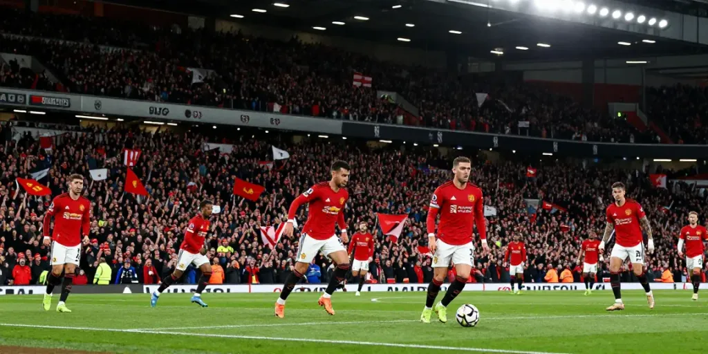 Manchester United vs Liverpool football match showcasing fierce rivalry and passionate fans.